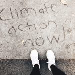 Climate action now writing into he concrete floor